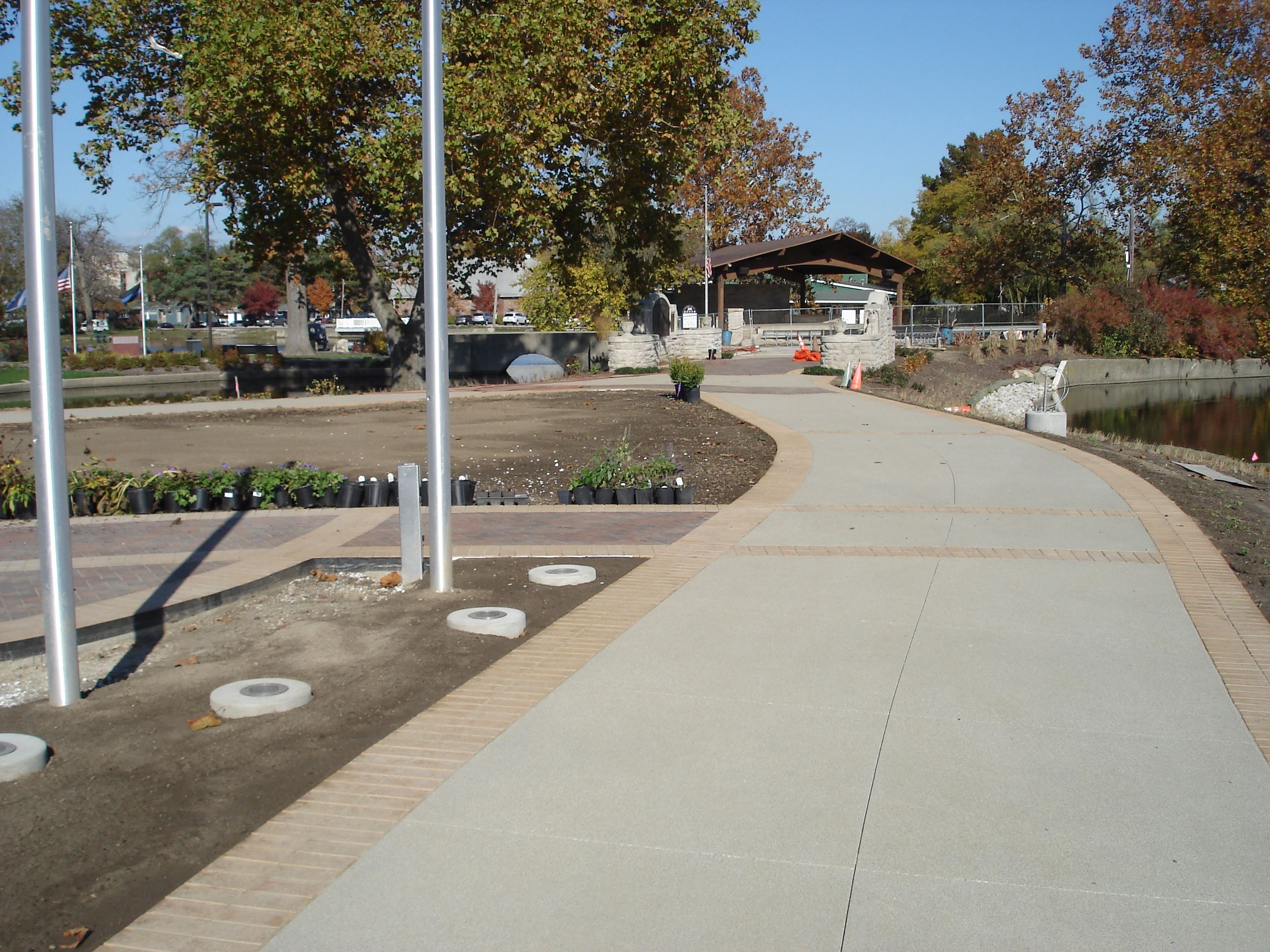 New sidewalk and pavers around Memorial Island
