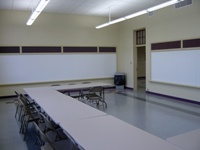 Writing boards, tables and chairs in the North Activity Room of McAllister Center